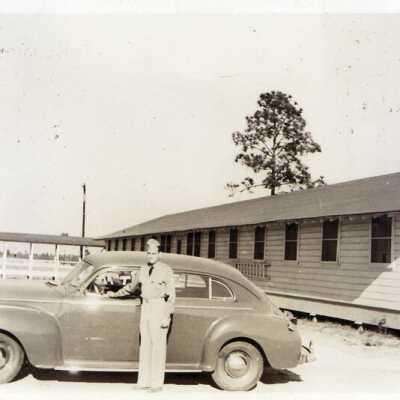 Camp Claiborne - Soldier with Car at Barracks