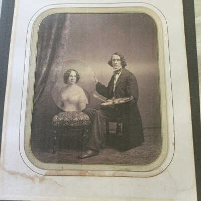 Photograph of Henry Pratt in his Studio holding a Portrait of his Wife