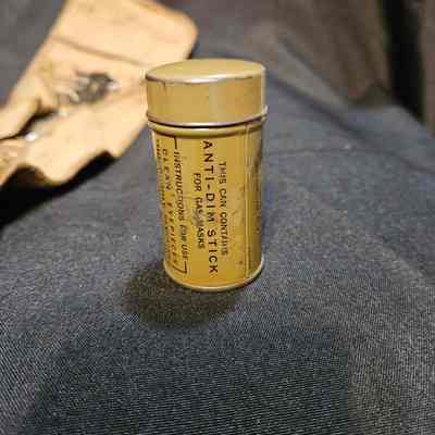 Container with buttons and thread