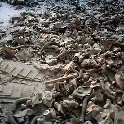 Gas Masks Scattered on the Floor of a School Lobby