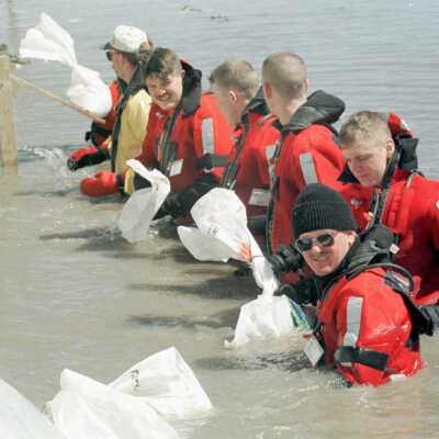 Guys in Wet Suits Sandbagging, May 3
