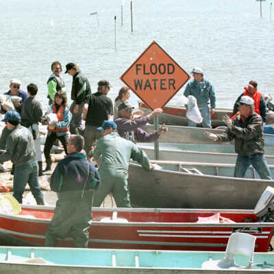 Boats with Flood Water Sign