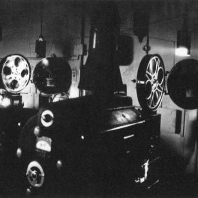 Everett Kvernum Running the Projectors at the Theater in Columbus. Columbus, Pop. 465 is Reportedly the Smallest Town in the State With An Active Theater, “ Hearts Of The West" Was Playing.Burke County, North Dakota, 1976 Dakota Photo Documentary Project