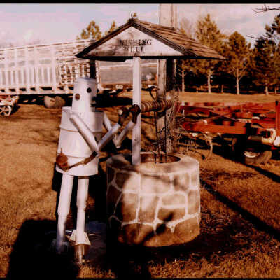 Wishing Well with Tin Man at Albert Redig's, Cathay, ND