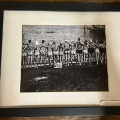 Row of swimmers standing on beach