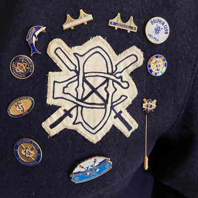 Suzanne's collection of pins on her DC letter fleece.