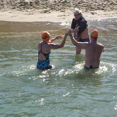 Brian handing out sticks at the beach finish, before the hat ( Feb. 24, 2013)