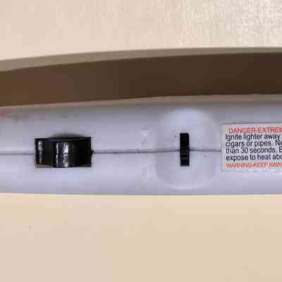 Two switches on bottom of handle.