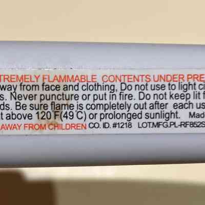Warning label on bottom of handle.