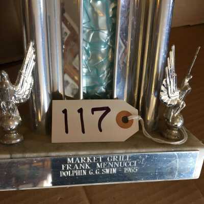 Engraved plate: Donated by Frank Menucci, no winner's name