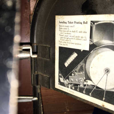 photo with instructions for installing printing roll in cash register