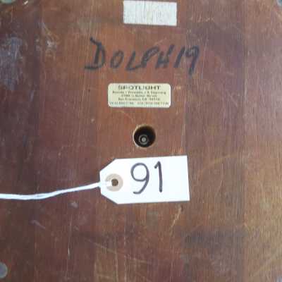 bottom view: Spotlight company Label, and "DOLPH 19" in black marker