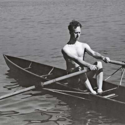 Dolphin Rowing a Skiff