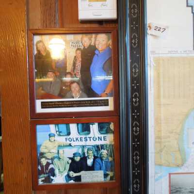 Dolphin swimming teams, 2 framed photos.