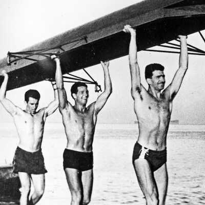 Crew Carrying Their Boat
