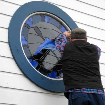 Dan Gamaldi installing window August 8, 2017