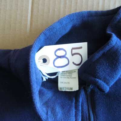 Close up of collar: Label shows 50% cotton 50% acrylic, size Medium