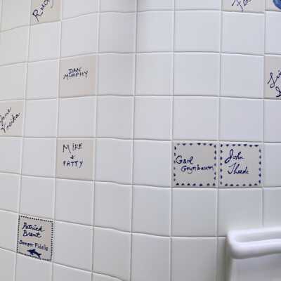 South wall and west wall of shower area, women's locker room: Sept 2020