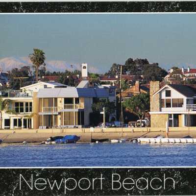Local snow-capped mountains behind Newport Beach, CA.