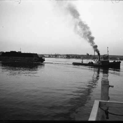 The Dredger being towed out of Newport Harbor