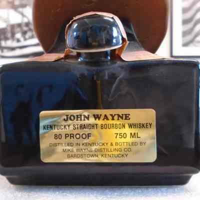 Product Label and Paper Bottle Seal: Label located on back of base (see inscriptions); details about paper seal noted in Condition