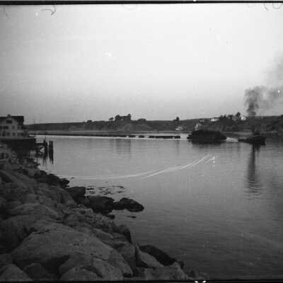 Dredger being towed out of Newport Harbor. 1936