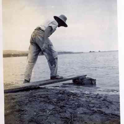 Man on a board on Balboa Island Beach, July 1911