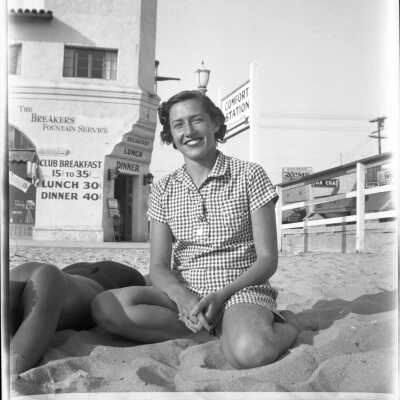 A Women Sitting on Balboa Beach, 1934