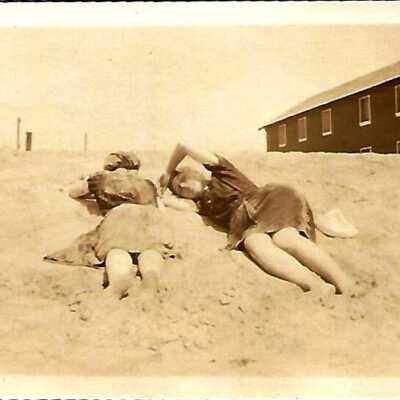 Friends Laying on the Beach Photo