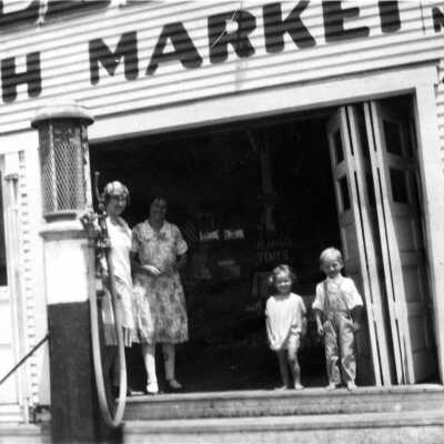 Women and Children in front of Wallie's Market