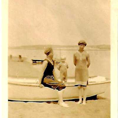 Friends Sitting by Boat Photo