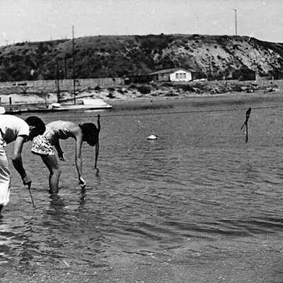 Ed Black and Flo Black Digging for Clams on East Bay Front