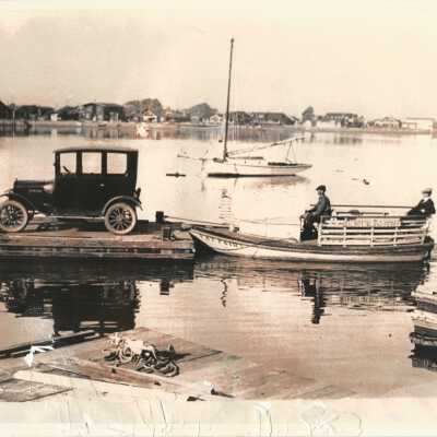 Ferry Pushing Car in Harbor