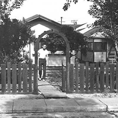 Ed Black in front of 210 and 212 Abalone Avenue