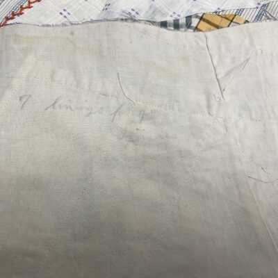 Penciled note about quilt on back: “7 linings for quilt squares”
