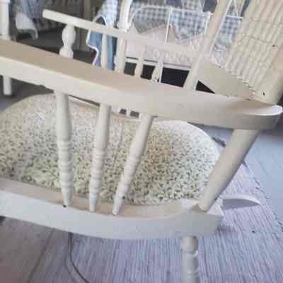 side view of the chair: Side view of the chair where again, the cushion is visible