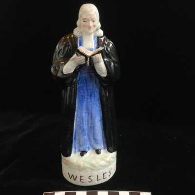 Sculpture of Wesley in Blue Holding a Book