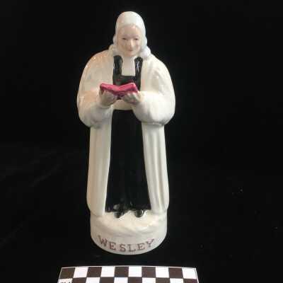 Sculpture of Wesley with Red ible and White Robe