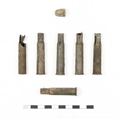 Items #14 (.30-30 cal casing), 40 (.45 ACP bullet), and 44 (five .30-06 casings) were excavated on 5/13/06