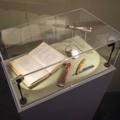 exhibition view of case with Frank Keeney's personal effects