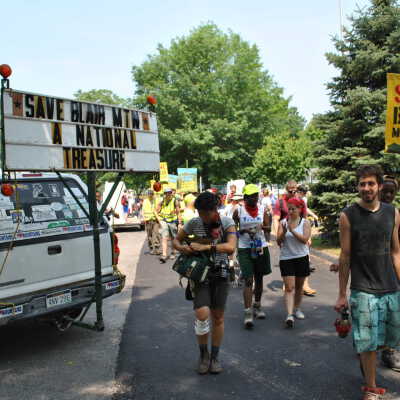 sign from this series in use during Blair Mountain March, Day Three (Wednesday, June 8), photo taken by "the Honey Wagon driver", Mark Haller (from Flickr)