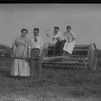 People Posing with Plow