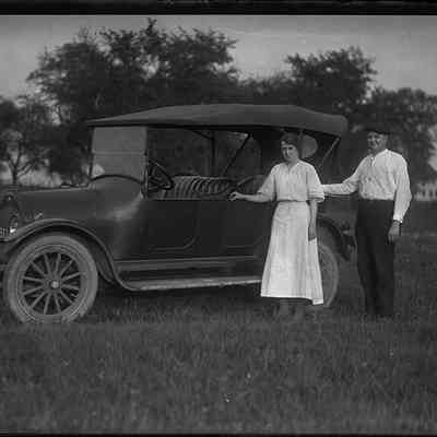 Woman and Man with Overland Touring Car