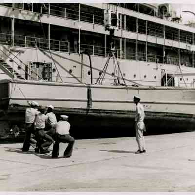 US Navy Personnel Perform Duties Pier Side