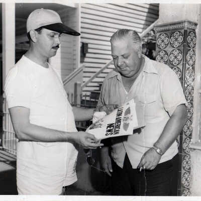 Two Men with Latin American News