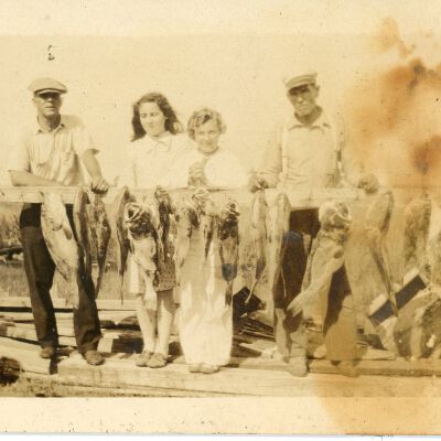 Four People with Fish