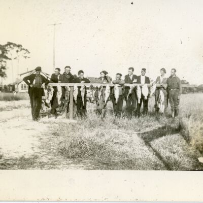 Men and Women with Hanging Fish