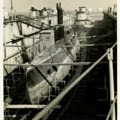 Submarine and Harbor Tug in Dry Dock