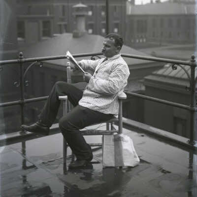 Unknown Man Reading Newspaper