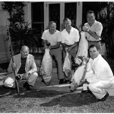 Unknown Men Displaying Their Fishing Catch